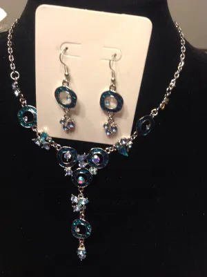 Bib style blue rhinestone necklace and earrings.